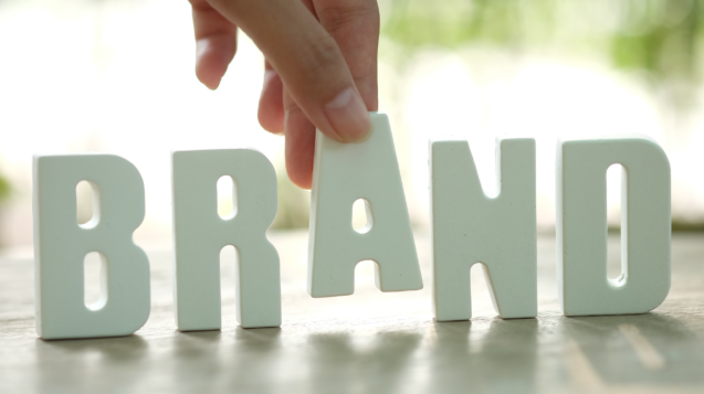 hand-arrange-white-letters-brand-01
